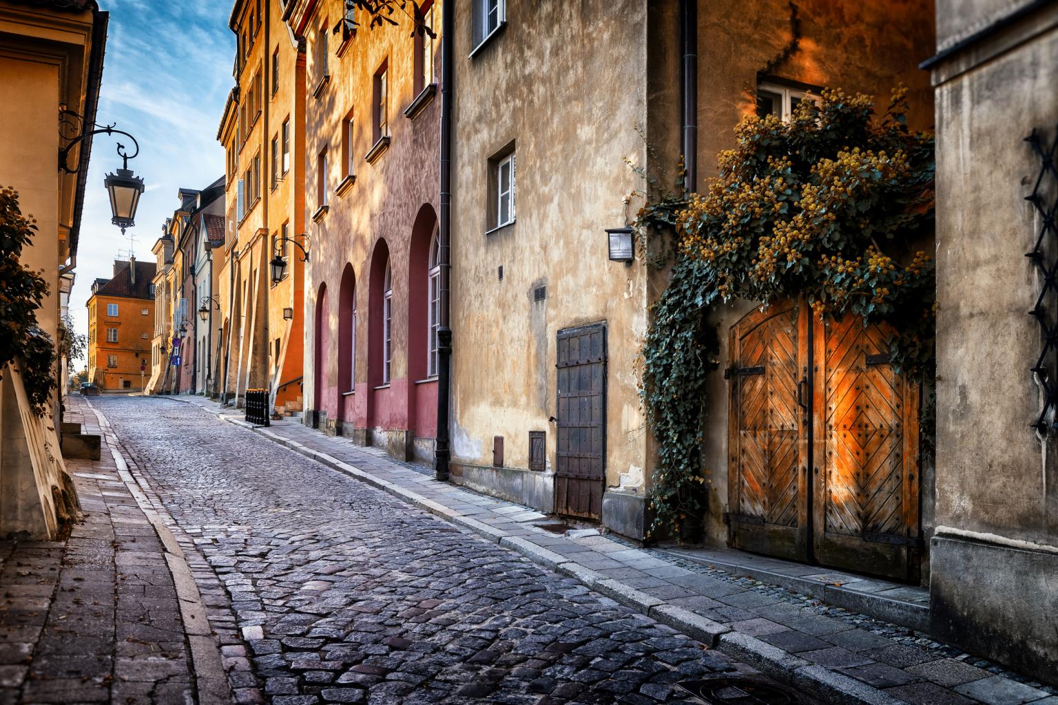 Autumn view of the birch street in the morning in Warsaw's Old Town, Poland iStock-1045577600